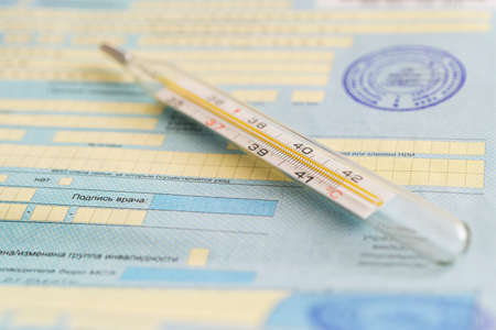 The thermometer is on the sick list- a document about temporary disability. Inscription in Russian...