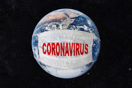 covid-19 sweeps world, world infected by coronavirus, planet earth with mask by coronavirus, world defends itself from the corona virus. pollution planet.の写真素材