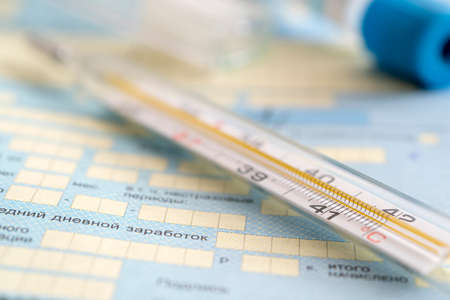 The thermometer is on the sick list- a document about temporary disability. Healthcare in Russia....
