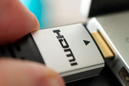hdmi high definition multimedia interface on hand. High-speed 8K signal transmission. HDMI connectorの写真素材