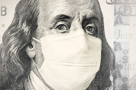 portrait of Benjamin Franklin from a hundred-dollar bill with a closed mouth Face Mask. global financial economic crisis because of the covid-19 coronavirus pandemicの写真素材