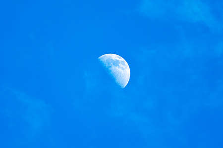 moon in a blue cloudless sky. moon day fieldの写真素材