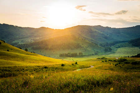 Sunny morning in mountain. Beautiful landscape composition. Sunset over the mountains. Summer landscape in the mountains. Serpentine mountain roadの写真素材