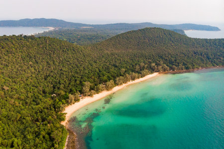 Long deserted beach with white sand and clear water. Aerial top view. island Koh Rong Samloem, Sihanoukville, Cambodia. This is a small island that attracts many vi. White sand beach and calm sea.のeditorial素材