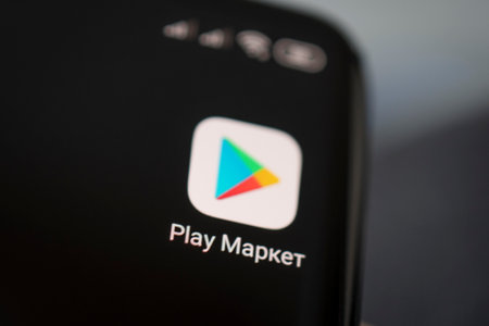 Icon of the play market, app on the screen of a black smartphone. Barnaul, Russia, February 10, 2021のeditorial素材