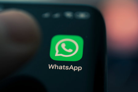 Icon of the whatsapp, app on the screen of a black smartphone. Barnaul, Russia, February 10, 2021