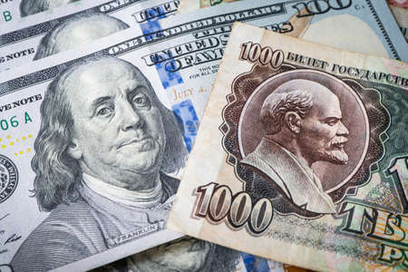 The Russian Soviet ruble and 100 of American dollars. confrontation between the capitalist and...