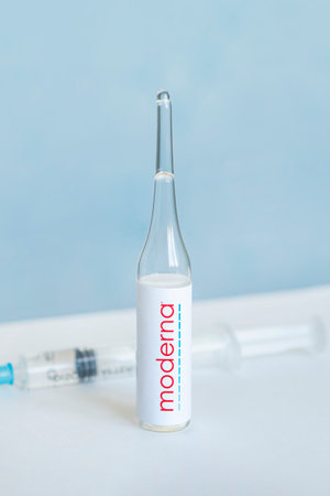 logo of the moderna company on a glass bottle with liquid for injections. february 27, 2021, Barnaul, Russia.のeditorial素材