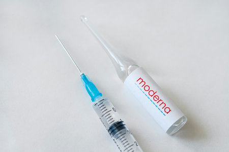 logo of the moderna company on a glass bottle with liquid for injections. february 27, 2021, Barnaul, Russia.のeditorial素材