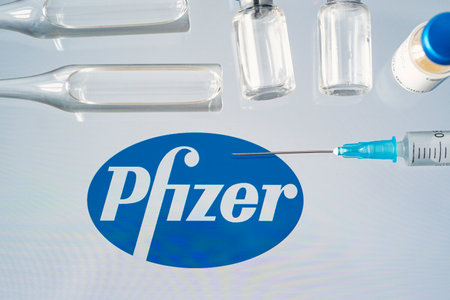 Vials of liquid on a white table and the of a large pharmaceutical company. March 15, Barnaul, Russia.のeditorial素材