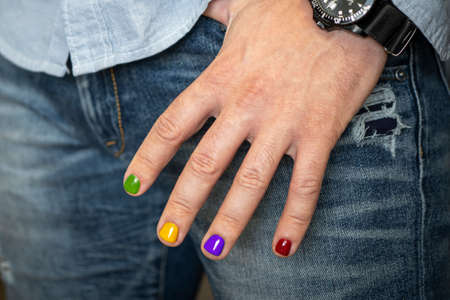 A man with painted nails. Design of male nails. men's manicure. Demonstration of a beautiful nail design.の写真素材