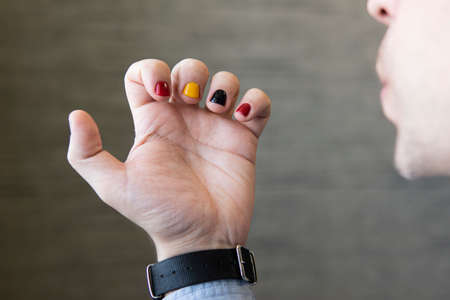 A man with painted nails. Design of male nails. men manicure.の写真素材