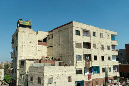 Ugly, not beautiful apartment buildings in Cairo. Construction of new modern residential building in Hurghada, Egypt. poor bad architecture, defective, construction.の写真素材