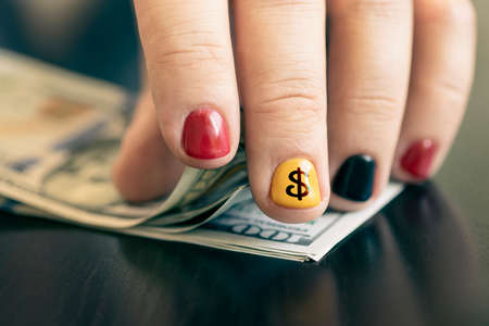 Hands counting us dollar bills. Business concept, counting money. A rich rapper with money. Men's...
