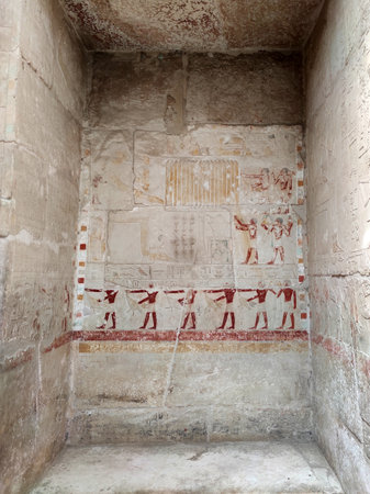 stone wall with Egyptian carving figures and hieroglyphs, Egypt, Africa.