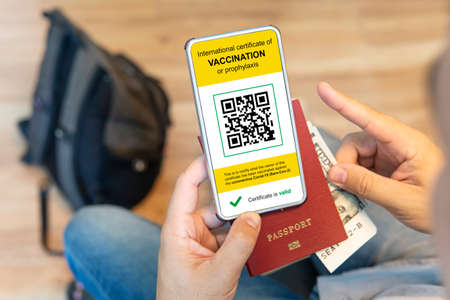 close up of view hands men holding smartphone display on app mobile vaccinated