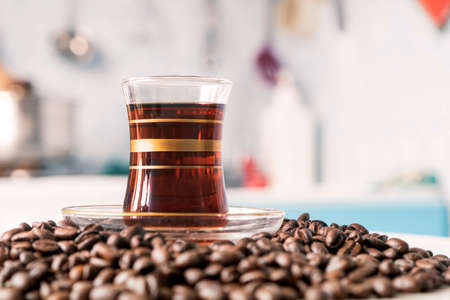 coffee coffee beans and coffee cup. copy space on the background of the kitchenの写真素材