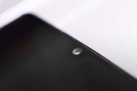 the front camera of the smartphone close-up. espionage on the use of social networks.