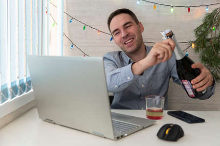 Office clerk celebrate Christmas at work. Celebrating Christmas and New Year in the workplace. An...