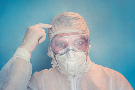 preventing virus, healthcare workers and vaccination concept. Close-up of mad outraged doctor in white coat. Think with your head.の写真素材