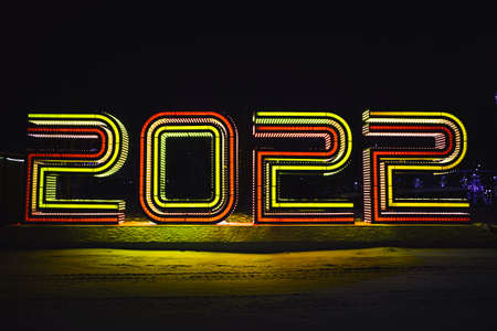 2022 happy new year written sparkling at night. Holiday 2022 Concept. decorative letters on the...