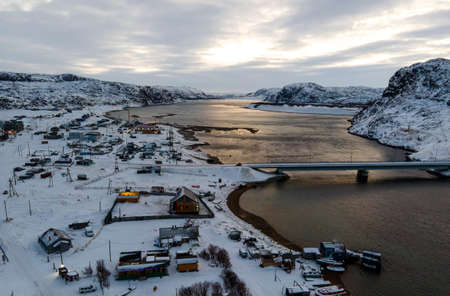 old fishing village on the shore of the sea. Teriberka is a village on the shore of the Arctic Ocean. The edge of the world. The far north of Russia.の写真素材