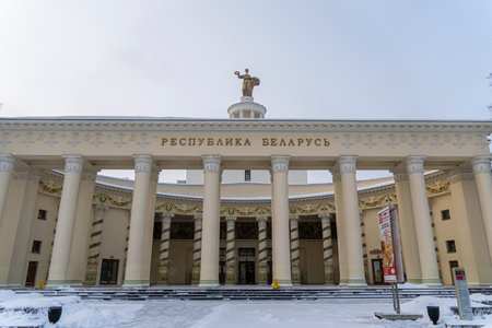 the inscription on the building Republic of Belarus . Moscow, VDNH, pavilion Republic of Belarus against a blue cloudy sky. December 18, 2021. Moscow. Russiaのeditorial素材