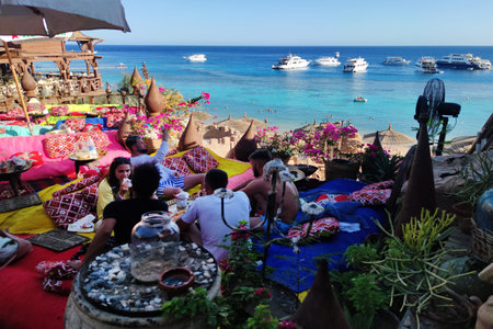October 19, 2021. Egypt. Sharm El Sheikh: Tourists relax in a Farsha Cafe a near Red Sea coastline of Sinaiのeditorial素材