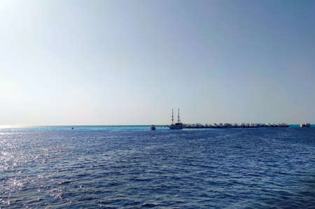 Lot off yachts against the backdrop of blue sky are anchored in the sea. Marine parking of boats and yachts in Egyptの写真素材