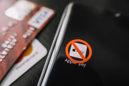 A crossed-out icon on a black smartphone screen. the concept of banning the application apple pay. April 1, 2022 Russiaのeditorial素材