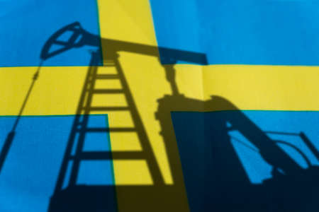purchase of oil in Sweden. Oil rigs on the background of the swedish flag. Mining and oil import....