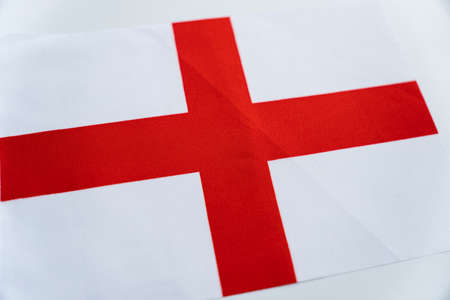 Flag of England silk. Fabric flag of England on a white tableの写真素材
