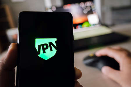 uses VPN application on smartphone. Virtual private network, anonymous, safe and secure internet access on mobile phone. Desktop banner, technology backgroundの写真素材