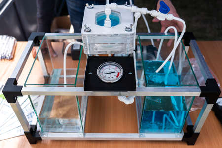 Close up of working device for enriching water with oxygen. the process of water purification from...