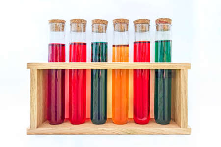 test tubes with colorful chemicals. fuel additive isolated on a white background