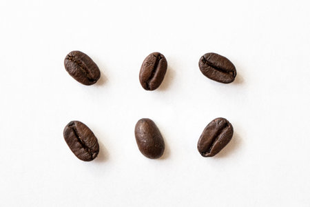 coffee beans. isolated on a white background. Roasted coffee beans close-up on a white background. macro photographyの写真素材
