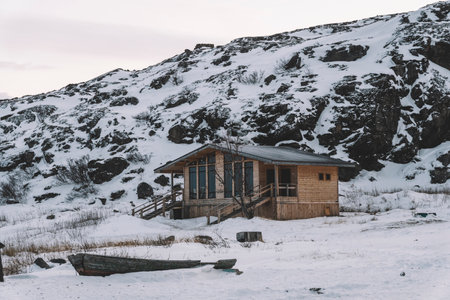 wooden houses on mountains at winter with a lot of snowの写真素材