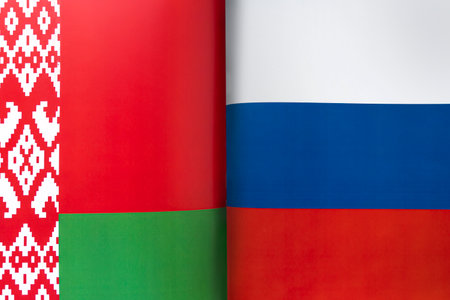 Background of the flags of the belarus and russia. The concept of interaction or counteraction...