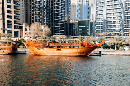 Old wooden ship, Dhow cruise in Dubai Marina, Dubai, United Arab Emirates. boat trip on a yacht.の写真素材