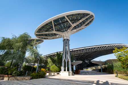large solar panels on the background of the sky in sunlight. The concept of green energy in the...