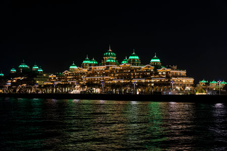 November 29, 2022. Dubai. United Arab Emirates. Sea view of the beautiful hotel raffles with green domesのeditorial素材