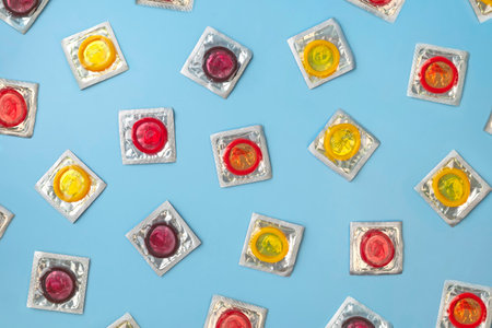 Top view Colorful condoms in a package on a blue background.の写真素材