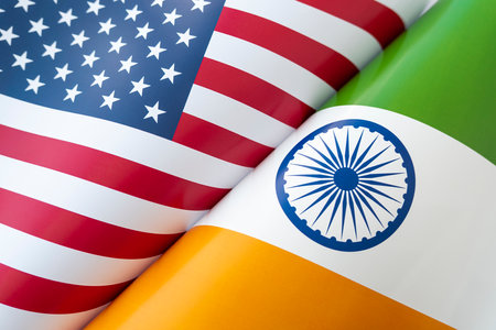 Background of the flags of the USA and india . The concept of interaction or counteraction between the two countries. international relations. political negotiations. sports competition.の写真素材