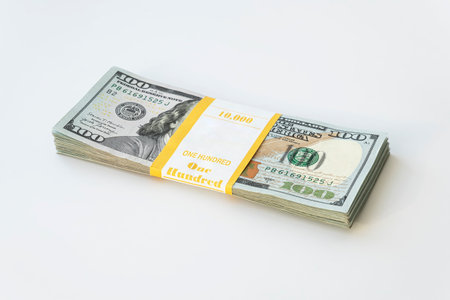 10,000 dollars packed in a bundle on a white background. business saving concept. lot of money.