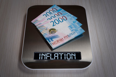 ruble bills on the electronic scales, a symbol of cost reduction, inflation, depreciation of money. concept of inflation in the russian federationの写真素材