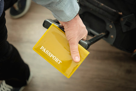 Airport, passport and ticket in man hand, travel suitcase and registration. Mobile, identity document and person with luggage for immigration and waiting for flight, concept of travel and immigrationの写真素材