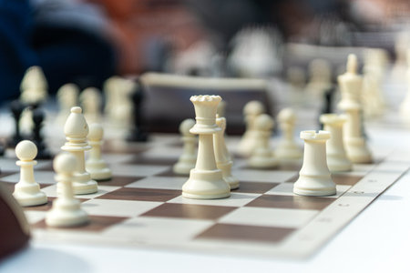 The game of chess. move in chess, white pawn. Large wooden chess set. white chess pieces on the boardの写真素材