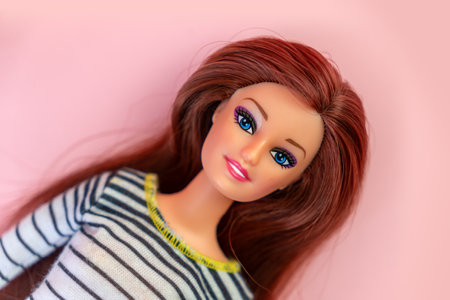 October 9, 2023. Barnaul, Russia: Portrait of brunette Barbie doll against pink background. Studio shot.のeditorial素材