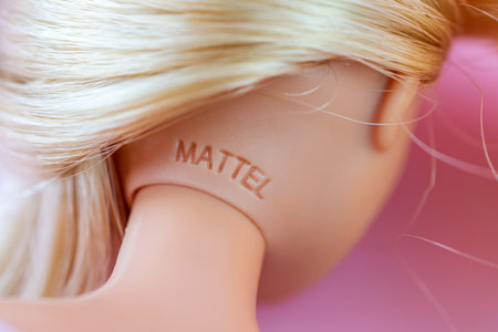 October 9, 2023. Barnaul, Russia: Barbie doll with loose blond hair on a blue background. inscription on the mattel on the head of the plastic dollのeditorial素材