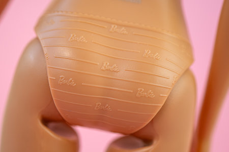 October 9, 2023. Barnaul, Russia: Barbie doll with loose blond hair on a blue background. inscription on the mattel on of the plastic dollのeditorial素材